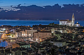 Aerial view of village buildings illuminated at night, Piran, Coastal-Karst, Slovenia