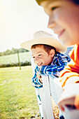 Caucasian children smiling on hay ride, Omaha, Nebraska, USA