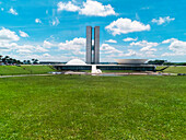 Brazil, Brasilia, National Congress of Brazil (architect: Oscar Niemeyer), grass in foreground