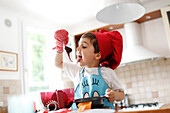 A little boy tasted the chocolate cake preparation