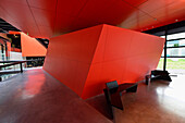 Europe,France, within the Frac Rennes, red wall and two benches black (architect Odile Decq)