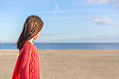 Young girl at the beach in winter