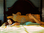 Caucasian woman laying on bed