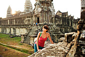 Woman visiting ancient temple, Angkor, Siem Reap, Cambodia