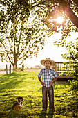Hispanic boy standing outdoors