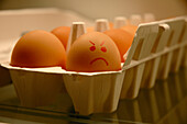 Carton of Eggs with one Egg Displaying an Angry Face