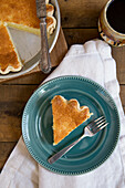 Slice of Buttermilk Pie on Blue Plate, High Angle View