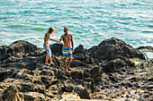 Couple are walking on the beach in Bali. Indonesia