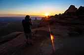 A photographer shoots the sunset at Canyonlands National Park near Moab, Utah.