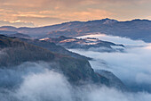 Mist shrouded mountains at dawn, Lake District, Cumbria, England, United Kingdom, Europe