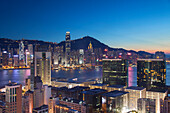 View of Hong Kong Island and Tsim Sha Tsui skylines at dusk, Hong Kong, China, Asia