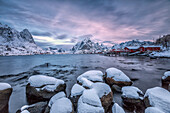Picturesque sunrise in the Bay of Reine with the typical Norwegian rorbu, once home for the fisherman, now tourist accommodation, Lofoten Islands, Arctic, Norway, Scandinavia, Europe