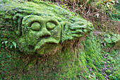 Moss covered sculptures in the forest, Goa Gajah Elephant Cave complex, Bali, Indonesia, Southeast Asia, Asia
