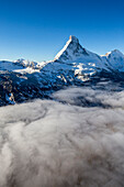 Fog revealing the mountain range surrounding the massif of the Matterhorn, Swiss Canton of Vaais, Swiss Alps, Switzerland, Europe