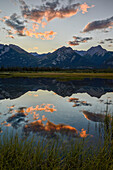 Orange clouds at sunset reflected in a lake, Jasper National Park, UNESCO World Heritage Site, Alberta, Rocky Mountains, Canada, North America