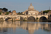 The River Tiber with Ponte Sant' Angelo bridge and St. Peter's Basilica, Rome, Lazio, Italy, Europe