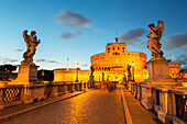 Angel statues on Ponte Sant' Angelo bridge with Castel Sant' Angelo at dusk, Rome, Lazio, Italy, Europe
