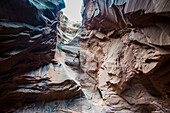 Man rapelling down in slot canyon, canyoneering, Moab, Utah, United States of America, North America