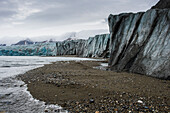 Gravel beach in front of a huge glacier in Hornsund, Svalbard, Arctic, Norway, Scandinavia, Europe