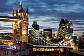 Tower Bridge and the City of London at night, London, England, United Kingdom, Europe