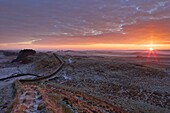 Sunrise and Hadrian's Wall National Trail in winter, looking to Housesteads Fort, Hadrian's Wall, UNESCO World Heritage Site, Northumberland, England, United Kingdom, Europe
