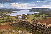 Drystone wall and stile with views to Windermere in autumn, Lake District National Park, Cumbria, England, United Kingdom, Europe