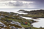 View out to sea over abandoned crofts at the township of Manish on the east coast of the Isle of Harris, Outer Hebrides, Scotland, United Kingdom, Europe