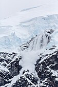Ice cornice avalanche at Neko Harbor, western side of the Antarctic Peninsula, Antarctica, Polar Regions