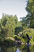 A pond in Queen Marys Gardens, Regents Park, London, England, United Kingdom, Europe