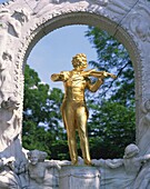 Gold statue of the musician Johann Strauss in Vienna, Austria, Europe