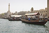 Abra water taxi crossing The Creek between Dur Dubai and Deira, Dubai, United Arab Emirates, Middle East