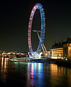 London Eye illuminated by moving coloured lights, London, England, United Kingdom, Europe