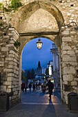 Gateway into town at night, Taormina, Sicily, Italy, Europe