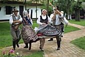 Folk dancing on horse farm in the Puszta, Hungary, Europe