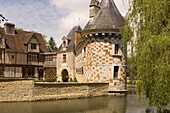 The chateau of St.-Germanine-de-Livet with a colourful checked facade and half timbered 15th century wing, Normandy, France, Europe