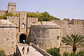 Tourists at the D'Amboise Gate and city walls around Rhodes Town, Rhodes, Dodecanese Islands, Greek Islands, Greece, Europe