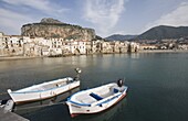 Traditional fishing boats and fishermens houses, Cefalu, Sicily, Italy, Europe