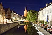 Reflection of Onze Lieve Vrouwekerk (Church of Our Lady), lit up at night, Old Town, UNESCO World Heritage Site, Bruges, Flanders, Belgium, Europe