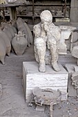 Horrea or Granai del Foro housing archaeological relics including plaster cast of victim of Vesuvius eruption, Pompeii, Campania, Italy, Europe
