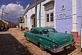 American Oldtimer in the cobbled streets of Trinidad, Cuba, West Indies, Caribbean, Central America