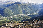 Hikers above Chamonix Valley, Mont Blanc Massif, French Alps, France, Europe