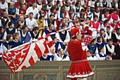 Flag bearer in parade at El Palio horse race festival, Piazza del Campo, Siena, Tuscany, Italy, Europe