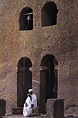 Priest reading a Bible in Bet Maryam church courtyard, UNESCO World Heritage Site, Lalibela, Wollo, Ethiopia, Africa