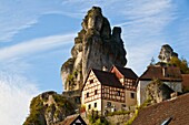 Timbered houses and huge rocks in Tuchersfeld, a village in the Franconian Switzerland region, Bavaria, Germany, Europe