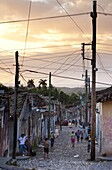 View along traditional cobbled street at sunset, Trinidad, Cuba, West Indies, Central America