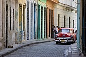 Colourful street with traditional old American car parked, Old Havana, Cuba, West Indies, Caribbean, Central America