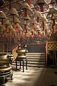 Burnign incense cones hung from the ceiling, Man Mo Temple, Sheung Wan, Hong Kong, China, Asia