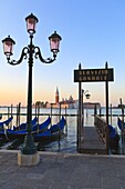 Gondolas moored by Riva degli Schiavoni, looking towards San Giorgio Maggiore, Venice, UNESCO World Heritage Site, Veneto, Italy, Europe