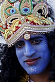 Man impersonating Hindu god Krishna at Janmashtami festival at Bhaktivedanta Manor ISKCON (Hare Krishna) temple, Watford, Hertfordshire, England, United Kingdom, Europe