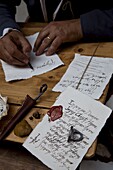 Ancient style of writing during an historical reenactment at Venice Arsenale, Venice, Veneto, Italy, Europe
